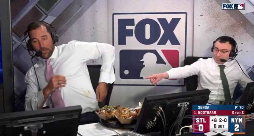 Fox announcers Adam Wainwright, left, and Jason Benetti discuss ballpark food during Saturday's game between the Cardinals and Mets. Photo Credit: Fox