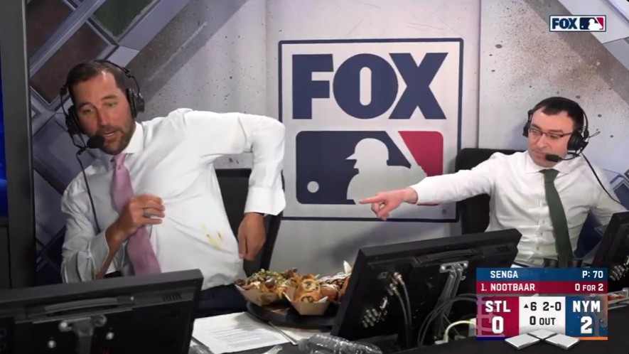 Fox announcers Adam Wainwright, left, and Jason Benetti discuss ballpark food during Saturday's game between the Cardinals and Mets. Photo Credit: Fox