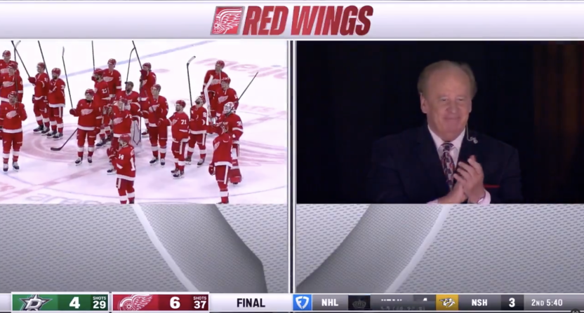 Red Wings players honoring John Keaton after his final home game on the ice