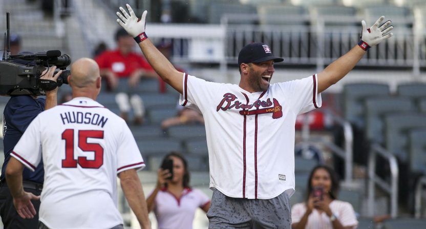Former Atlanta Braves outfielder Jeff Francoeur (7) and starting pitcher Tim Hudson (15) celebrate after winning the Alumni Softball Home Run Derby before a game against the Milwaukee Brewers at SunTrust Park.