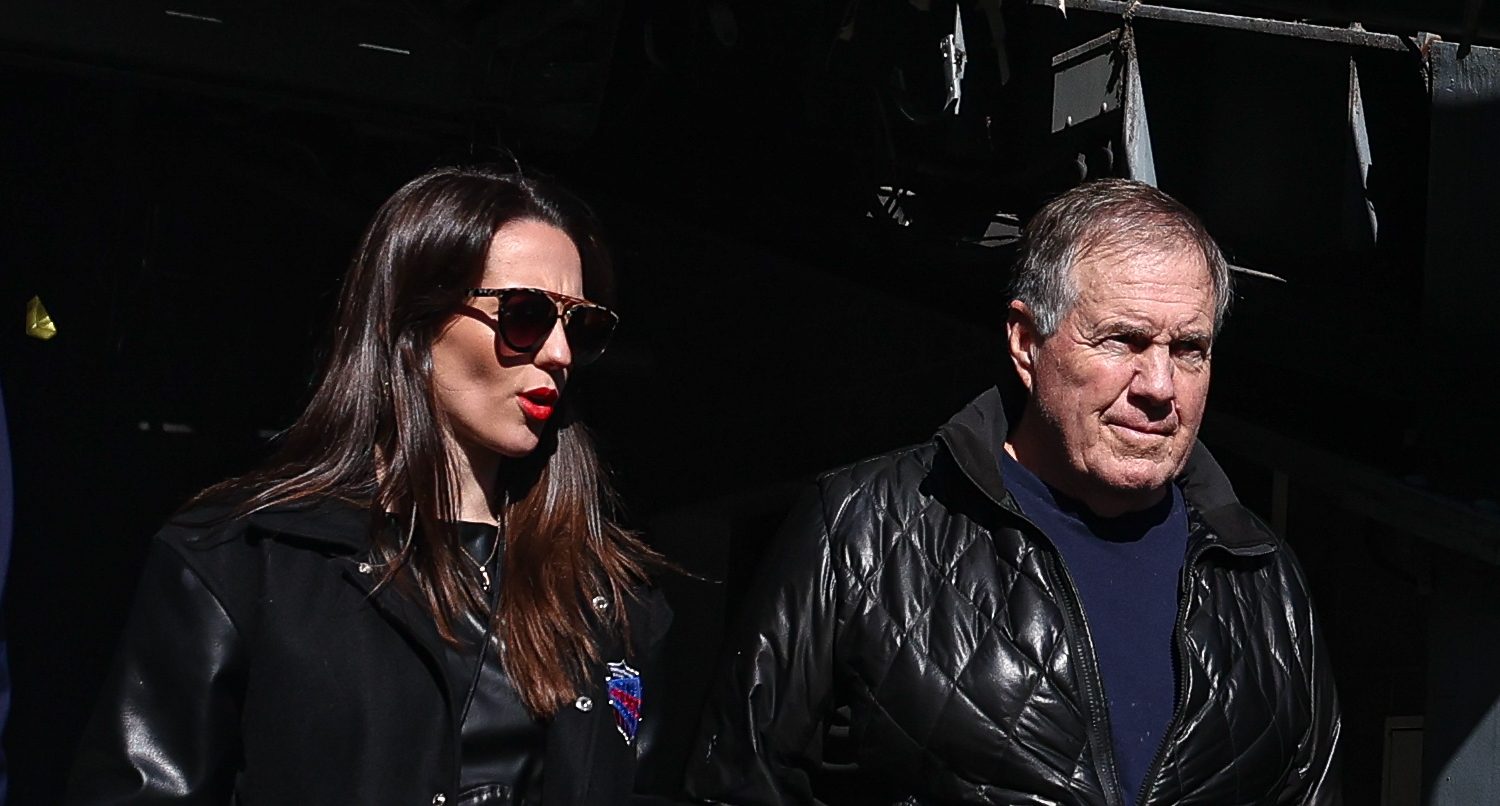 Oct 26, 2024; East Rutherford, New Jersey, USA; Former New England Patriots head coach Bill Belichick and girlfriend Jordon Hudson enter the field before the game between the Notre Dame Fighting Irish and the Navy Midshipmen at MetLife Stadium.