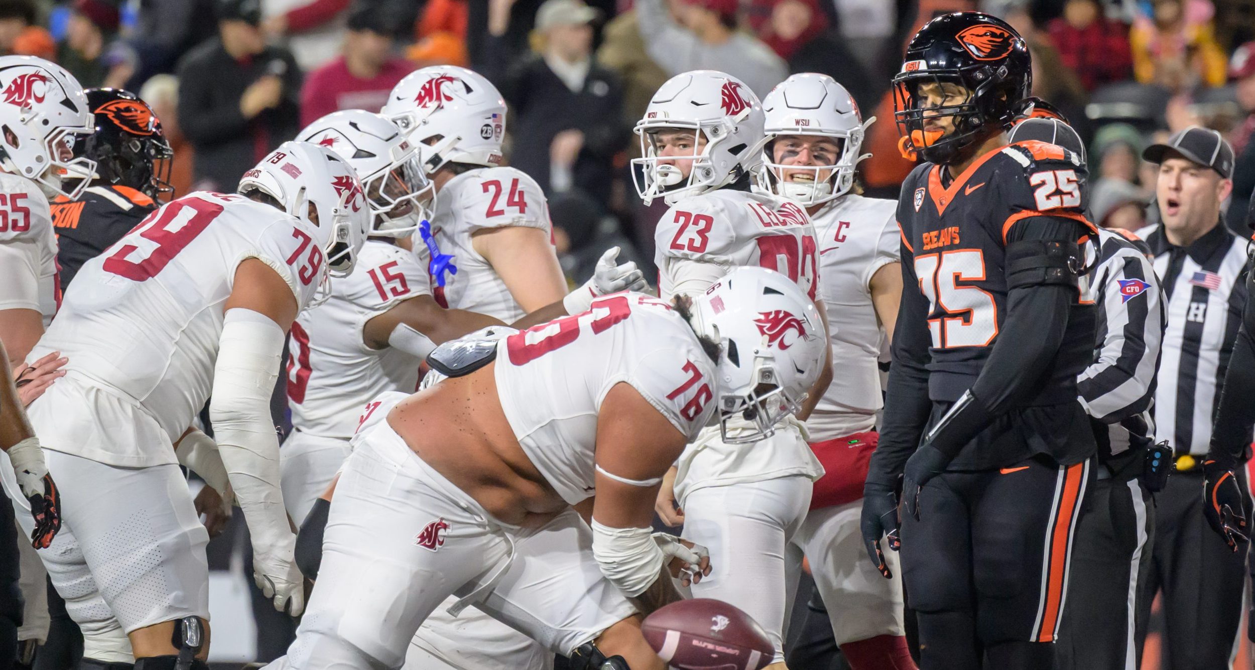 Washington State Cougars offensive lineman Esa Pole (76) spikes the football during a touchdown celebration during the second quarter against the Oregon State Beavers