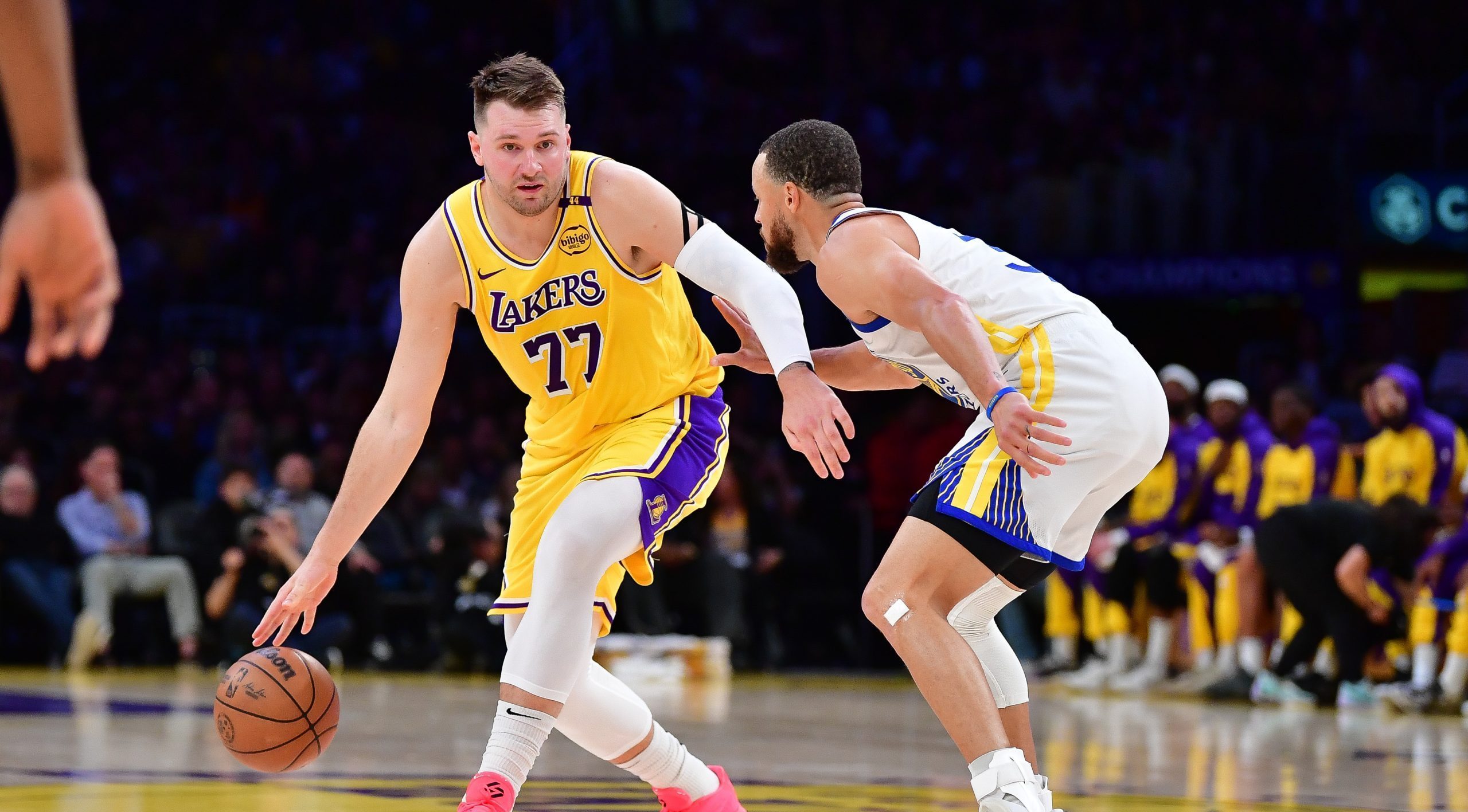 Luka Dončić and Steph Curry face off in Thursday's game between the Los Angeles Lakers and Golden State Warriors. Mandatory Credit: Gary A. Vasquez-Imagn Images