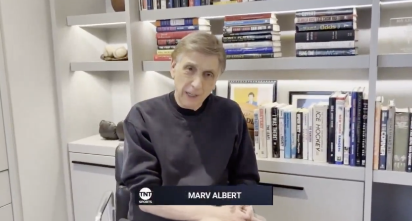 Marv Albert congratulating his son, Kenny Albert, for surpassing his record for the number of nationally televised broadcasts