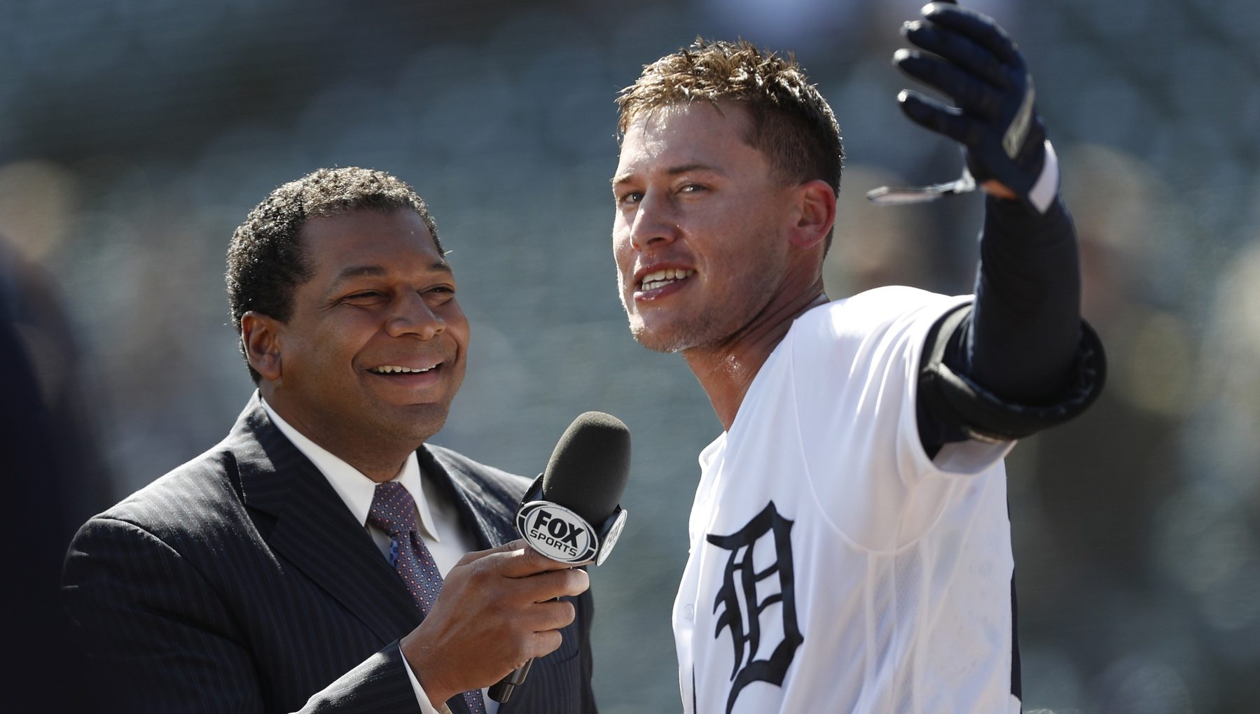 Apr 20, 2018; Detroit, MI, USA; Detroit Tigers center fielder JaCoby Jones (21) does an interview after the game with Trevor Thompson after hitting a walk off solo home run to beat the Kansas City Royals at Comerica Park. Mandatory Credit: Raj Mehta-USA TODAY Sports