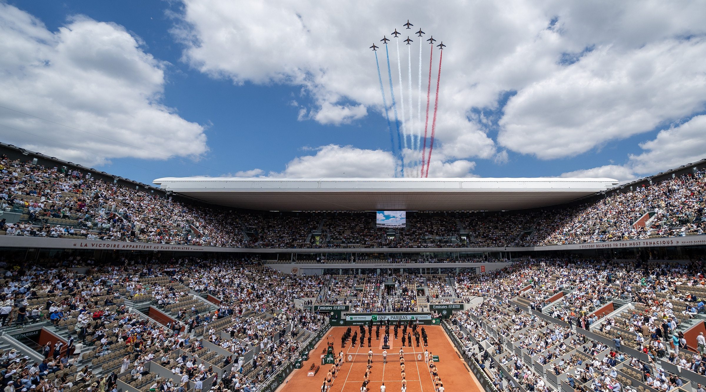 The French air patrol flies over Philippe-Chatrier before Carlos Alcaraz of Spain and Alexander Zverev of Germany compete in the mens final on day 15 of Roland Garros at Stade Roland Garros.