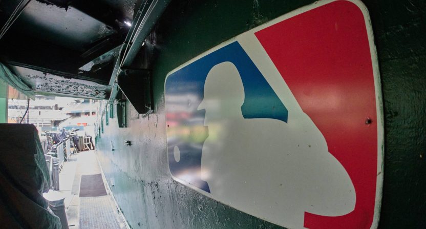 The major league baseball logo is seen on signage near the player's entrance to the field at Oakland-Alameda County Coliseum