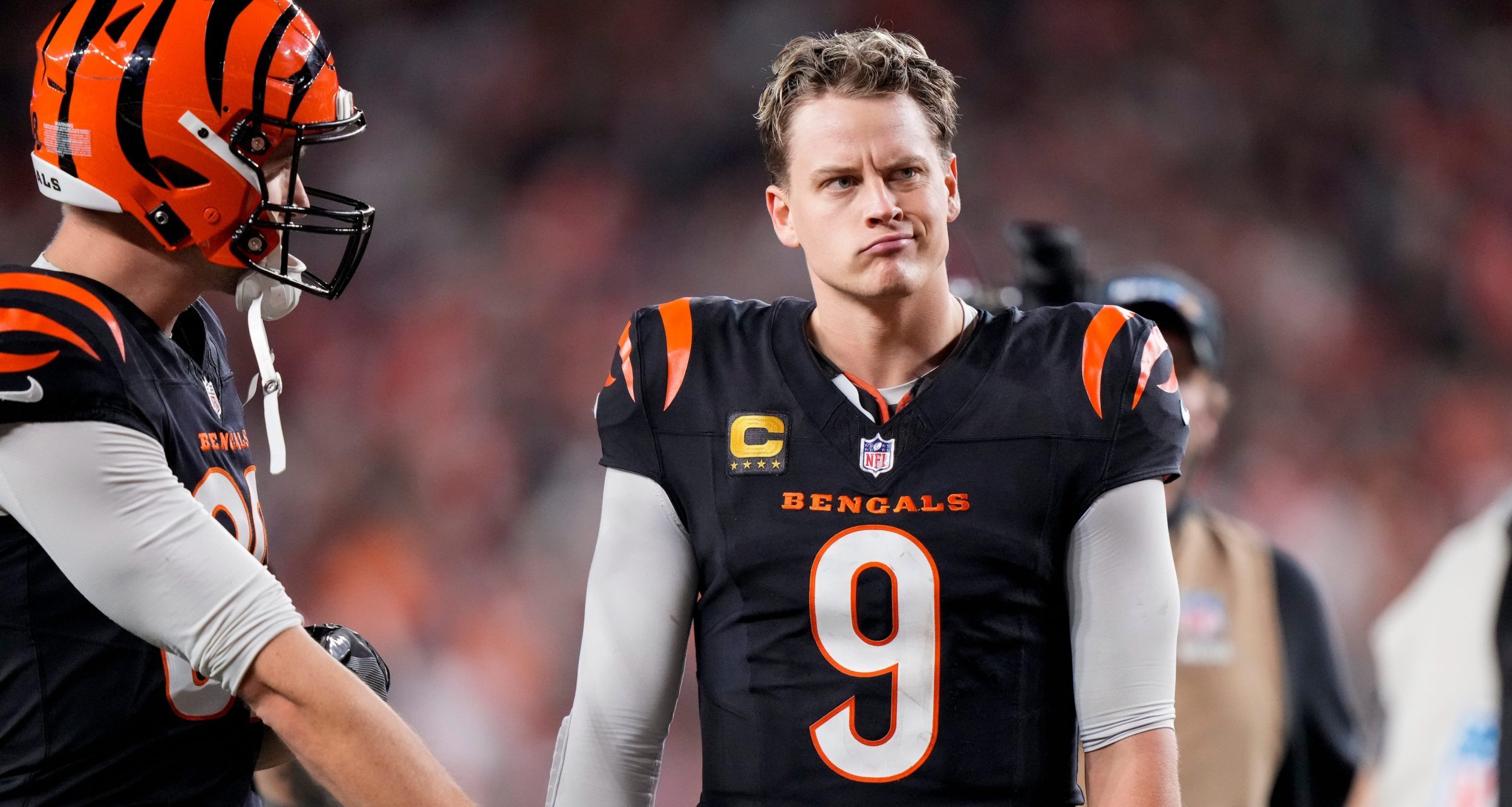 Cincinnati Bengals quarterback Joe Burrow (9) celebrates after the game-winning touchdown pass to Tee Higgins in overtime of the NFL Week 17 game between the Cincinnati Bengals and the Denver Broncos at Paycor Stadium in downtown Cincinnati on Saturday, Dec. 28, 2024. The Bengals took a 30-24 win in overtime to remain in the post season chase.
