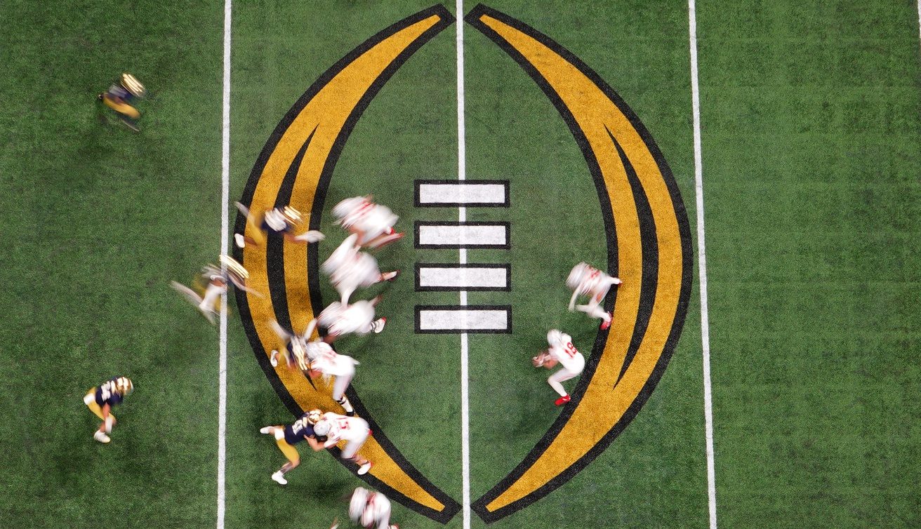 Jan 20, 2025; Atlanta, GA, USA; Ohio State Buckeyes quarterback Will Howard (18) prepares to hand off the ball during the third quarter against the Notre Dame Fighting Irish in the College Football Playoff National Championship game at Mercedes-Benz Stadium. Mandatory Credit: James Lang-Imagn Images
