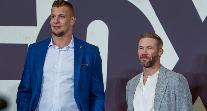 Former New England Patriots Rob Gronkowski and Julian Edelman defended Bill Belichick's girlfriend, Jordon Hudson.