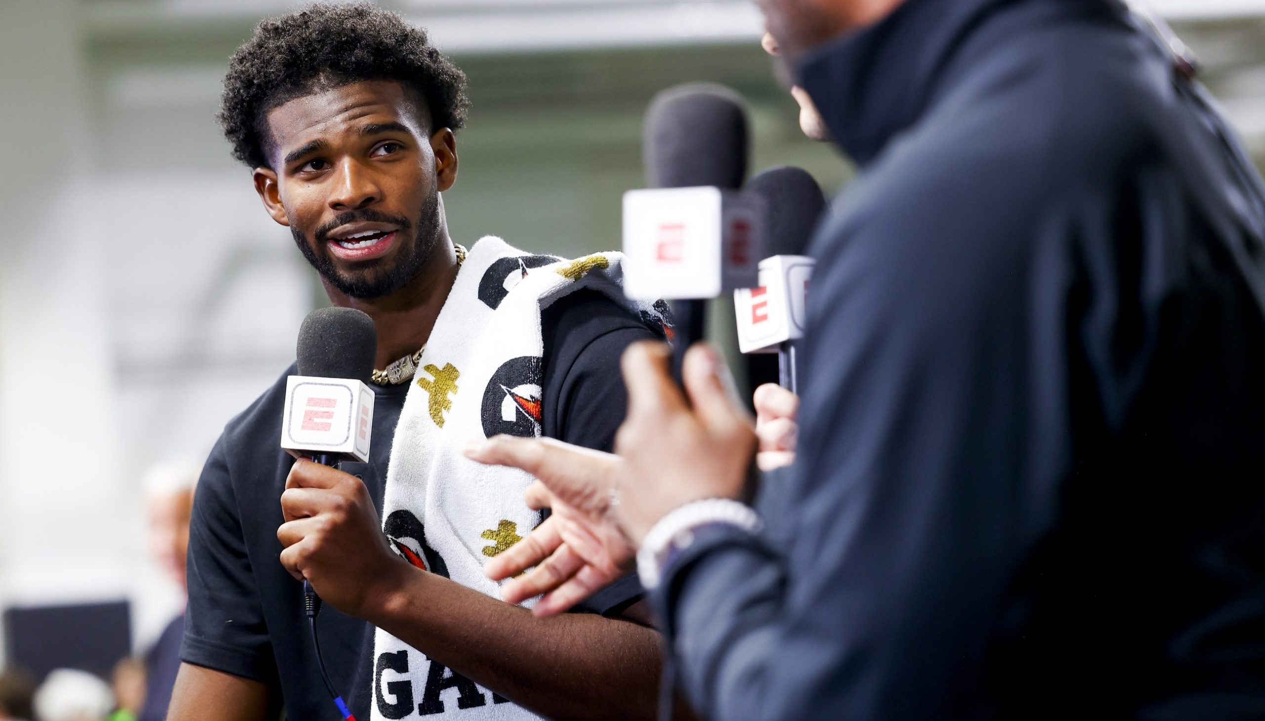 Apr 4, 2025; Boulder, CO, USA; Colorado Buffaloes quarterback Shedeur Sanders (2) talks to ESPN after the University of Colorado NFL Showcase at the CU Indoor Practice Facility. Mandatory Credit: Michael Ciaglo-Imagn Images