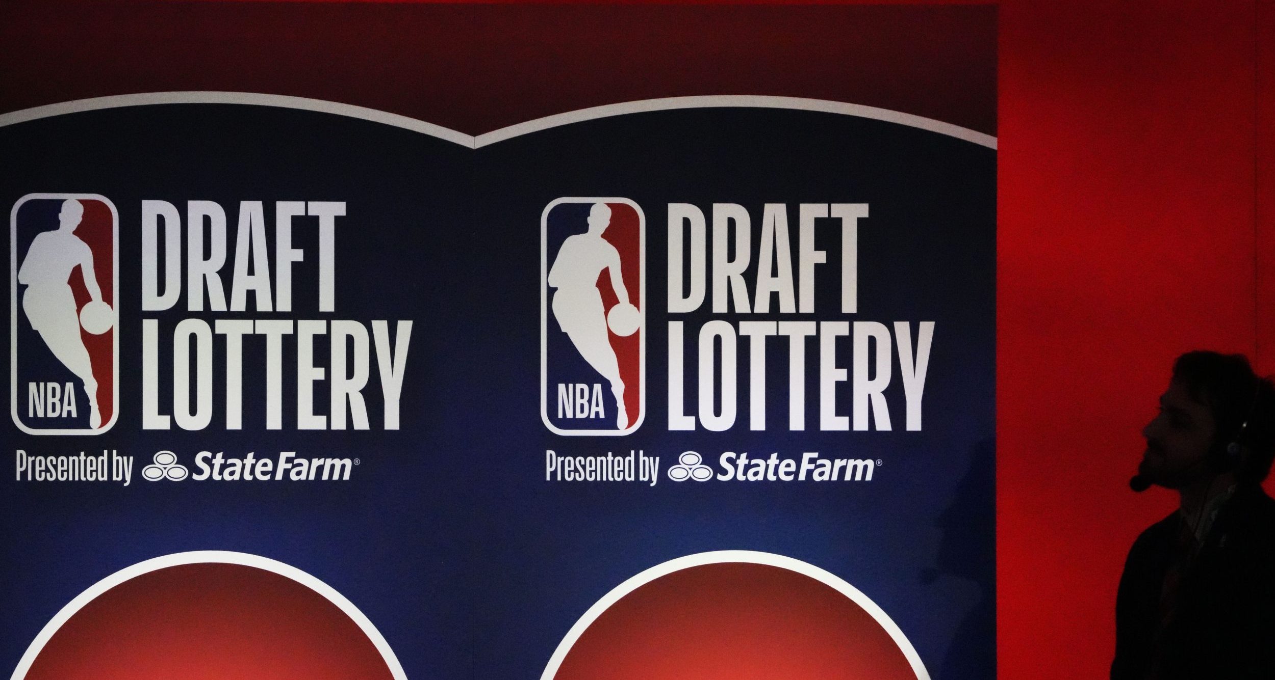 A person watches the 2025 NBA Draft Lottery