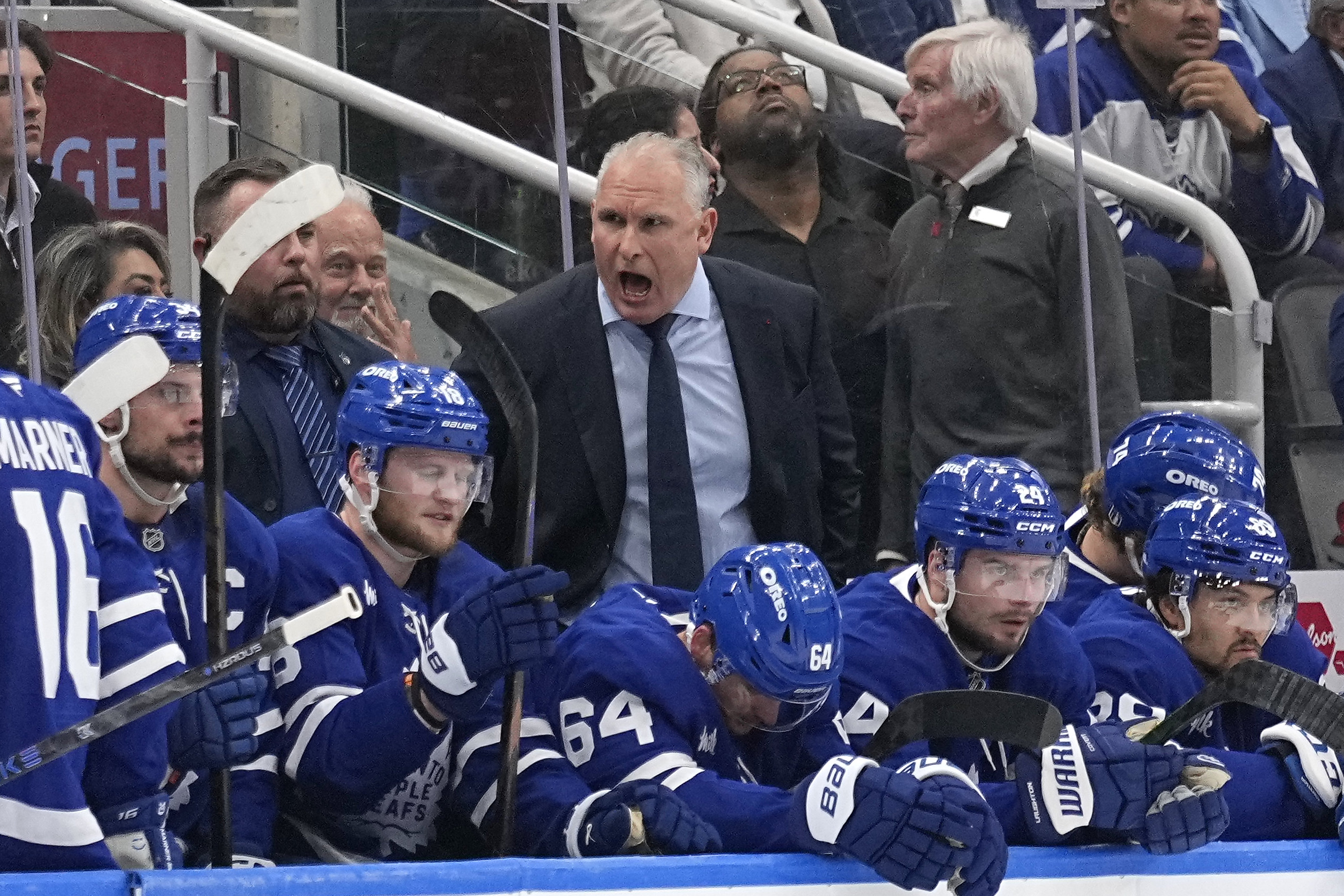 May 14, 2025; Toronto, Ontario, CAN; Toronto Maple Leafs head coach Craig Berube (center dark suit) talks to his players during the first period of game five of the second round of the 2025 Stanley Cup Playoffs against the Florida Panthers at Scotiabank Arena. Mandatory Credit: John E. Sokolowski-Imagn Images