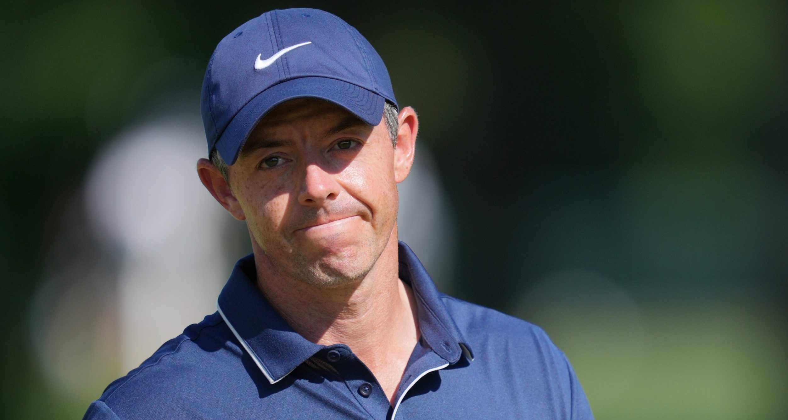 Rory McIlroy reacts after a putt on the second green during the third round of the PGA Championship