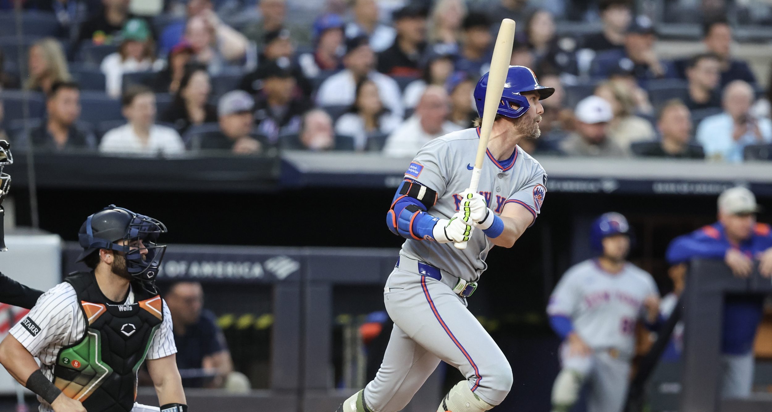 May 18, 2025; Bronx, New York, USA; New York Mets center fielder Jeff McNeil (1) hits an RBI single in the second inning against the New York Yankees at Yankee Stadium.