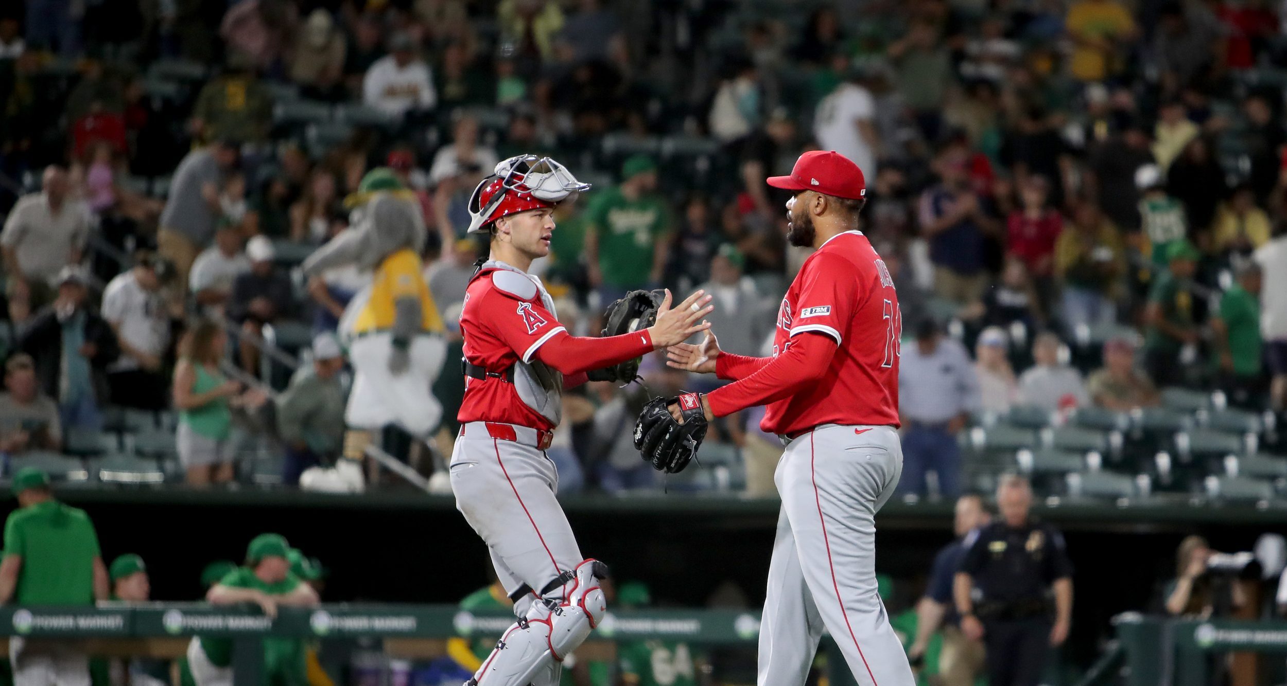 May 19, 2025; West Sacramento, California, USA; Los Angeles Angels pitcher Kenley Jansen (74) and catcher Logan O'Hoppe (14) shake hands after defeating the Athletics 4-3 at Sutter Health Park.
