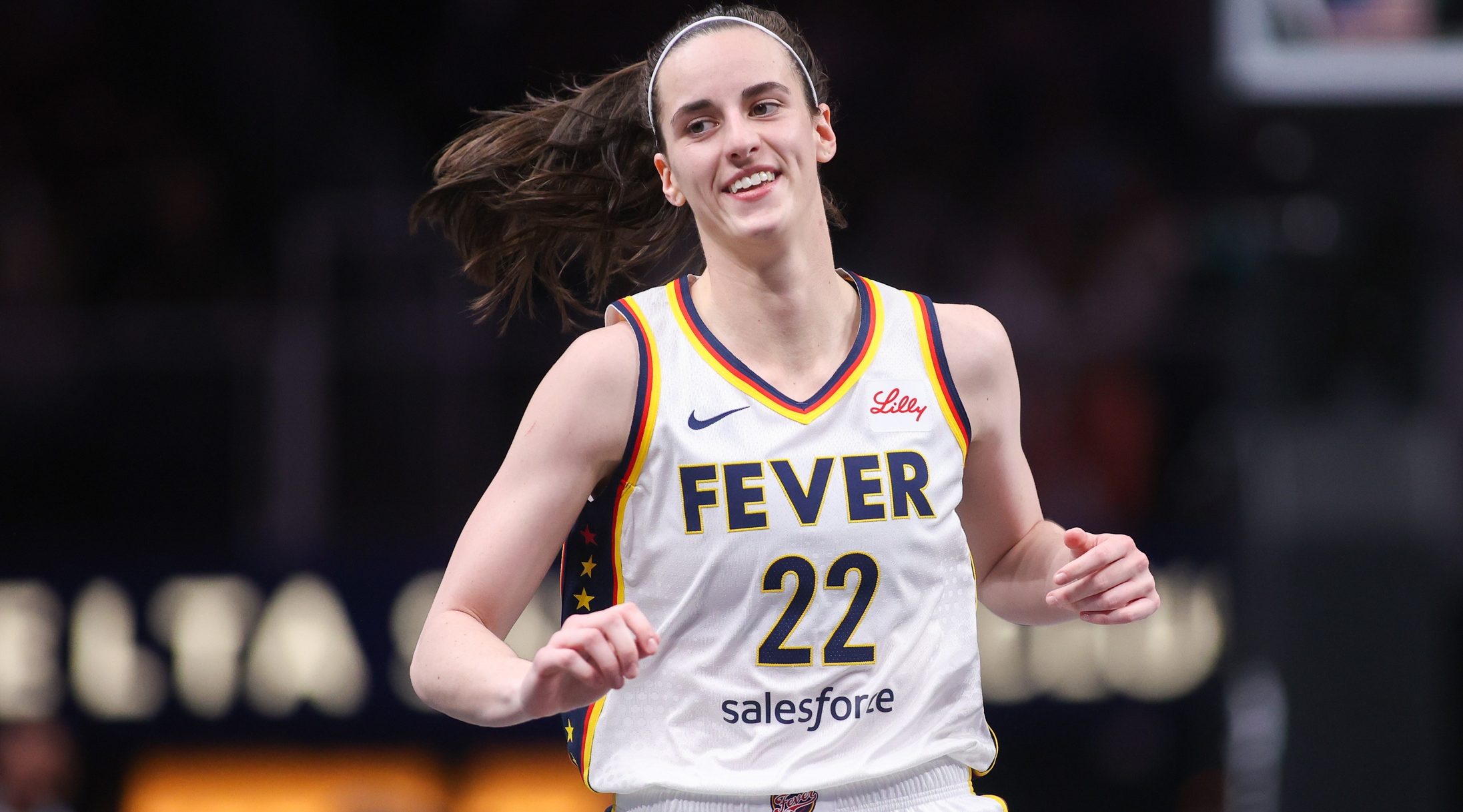 May 22, 2025; Atlanta, Georgia, USA; Indiana Fever guard Caitlin Clark (22) reacts after a basket against the Atlanta Dream in the first half at State Farm Arena. Mandatory Credit: Brett Davis-Imagn Images