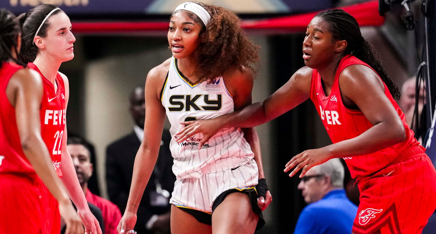 Angel Reese (center) goes after Caitlin Clark following a flagrant foul.