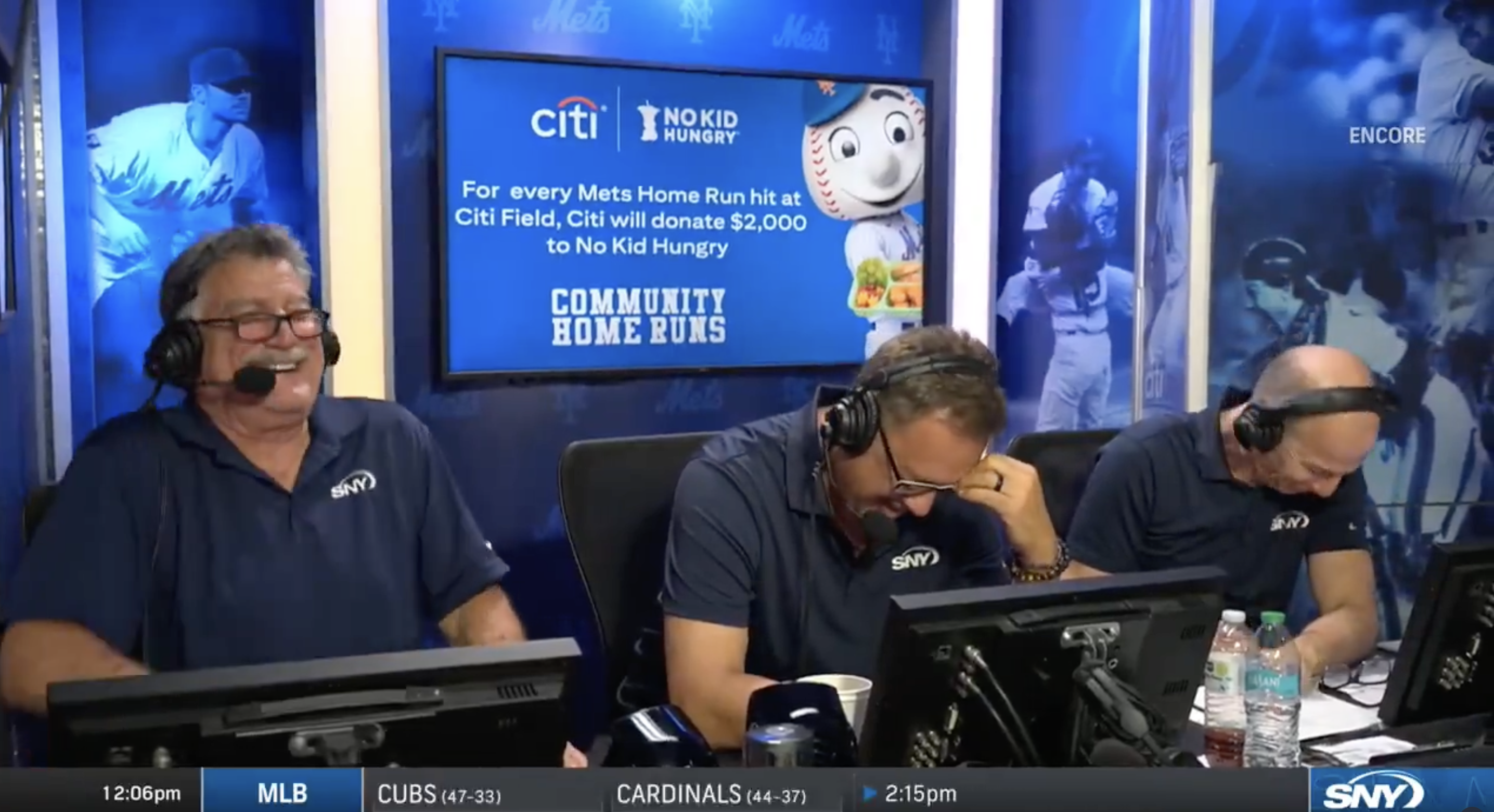 A look into the Mets broadcast booth showing Keith Hernandez, Ron Darling, and Gary Cohen