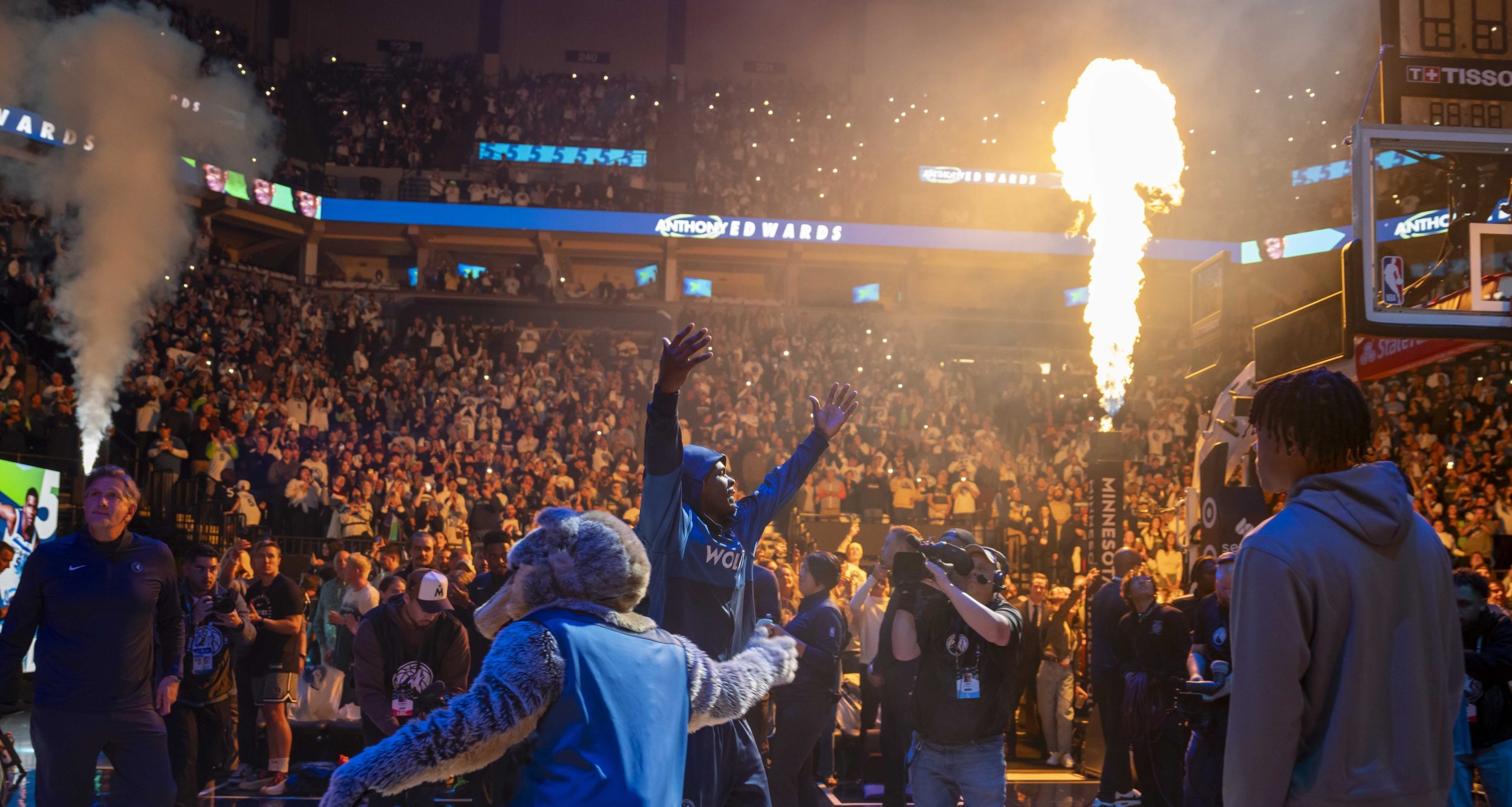 Minnesota Timberwolves guard Anthony Edwards (5) steps onto the floor during starting lineup entrances before a game against the Toronto Raptors at Target Center.