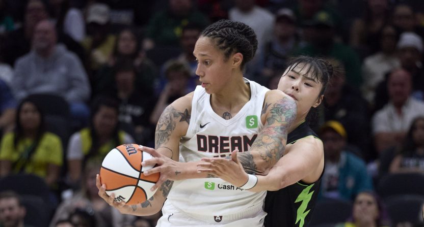 May 30, 2025; Seattle, Washington, USA; Atlanta Dream center Brittney Griner (42) controls the ball under pressure from Seattle Storm center Li Yueru (28) during the first half at Climate Pledge Arena.