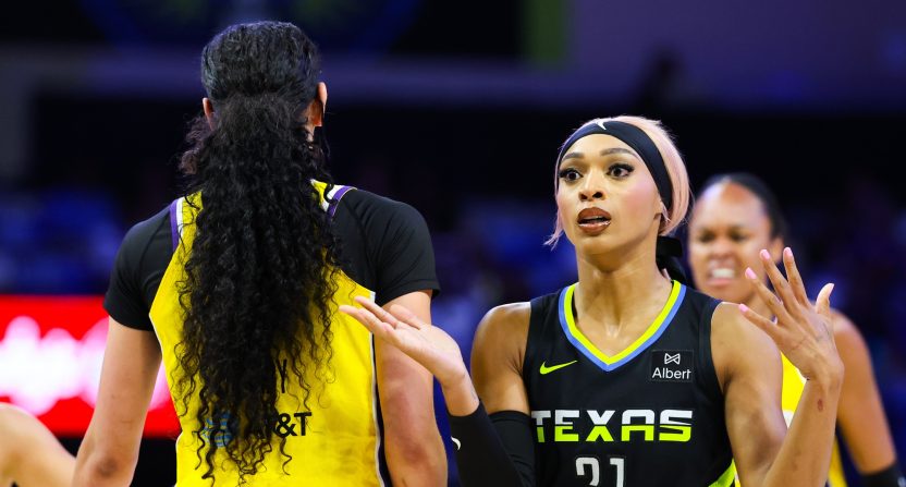 Dallas Wings guard DiJonai Carrington (21) reacts as Los Angeles Sparks forward Dearica Hamby (5) celebrates during the first half at College Park Center. Mandatory