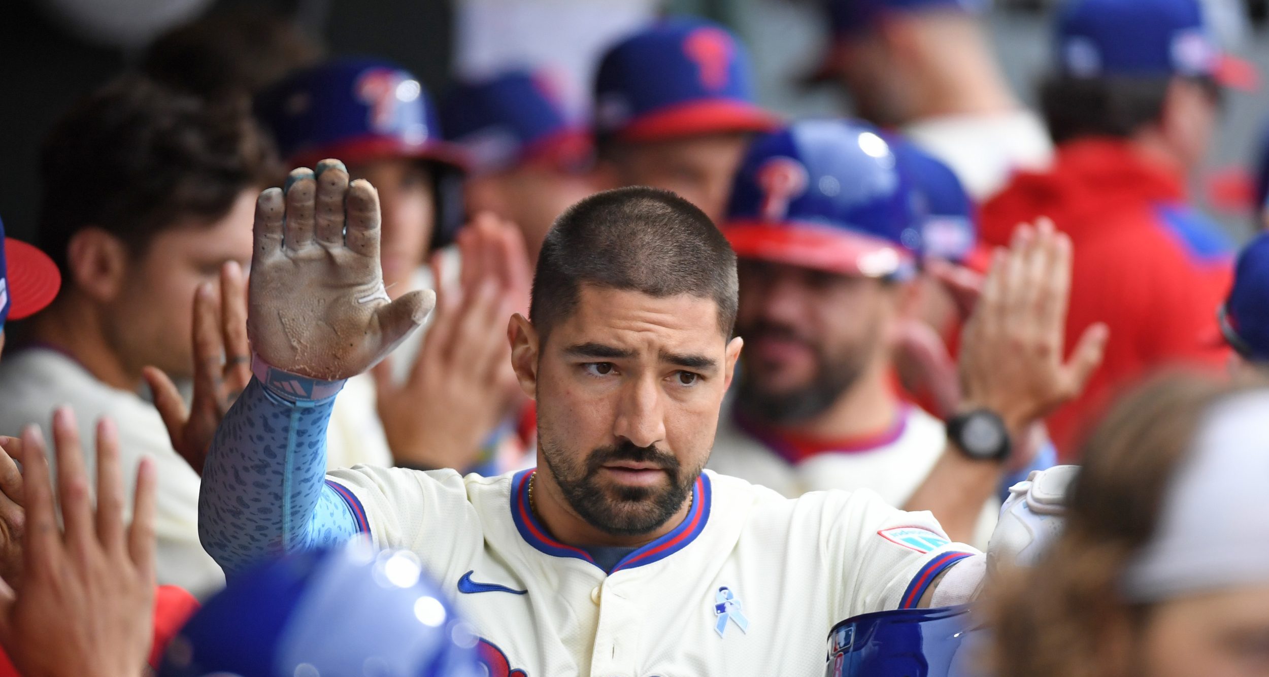 Jun 15, 2025; Philadelphia, Pennsylvania, USA; Philadelphia Phillies outfielder Nick Castellanos (8) celebrates his grand slam home run in the dugout during the sixth inning against the Toronto Blue Jays at Citizens Bank Park.