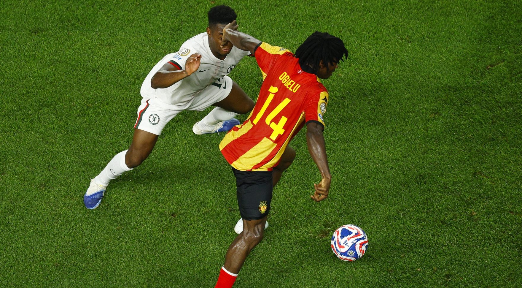 [Subscription Customers Only] Jun 24, 2025; Philadelphia, Pennsylvania, USA; Chelsea FC midfielder Dario Essugo (14) in action with Esperance Sportive De Tunisie midfielder Onuche Ogbelu (14) during a group stage match of the 2025 FIFA Club World Cup at Lincoln Financial Field. Mandatory Credit: Susana Vera-Reuters via Imagn Images