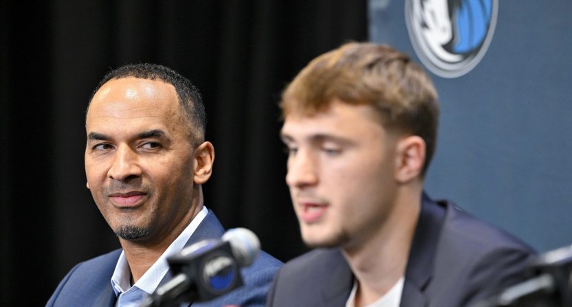 Jun 27, 2025; Dallas, TX, USA; Dallas Mavericks general manager Nico Harrison (left) looks on with Mavericks first overall pick Cooper Flagg (right) at a press conference at the Dallas Mavericks Practice Facility.