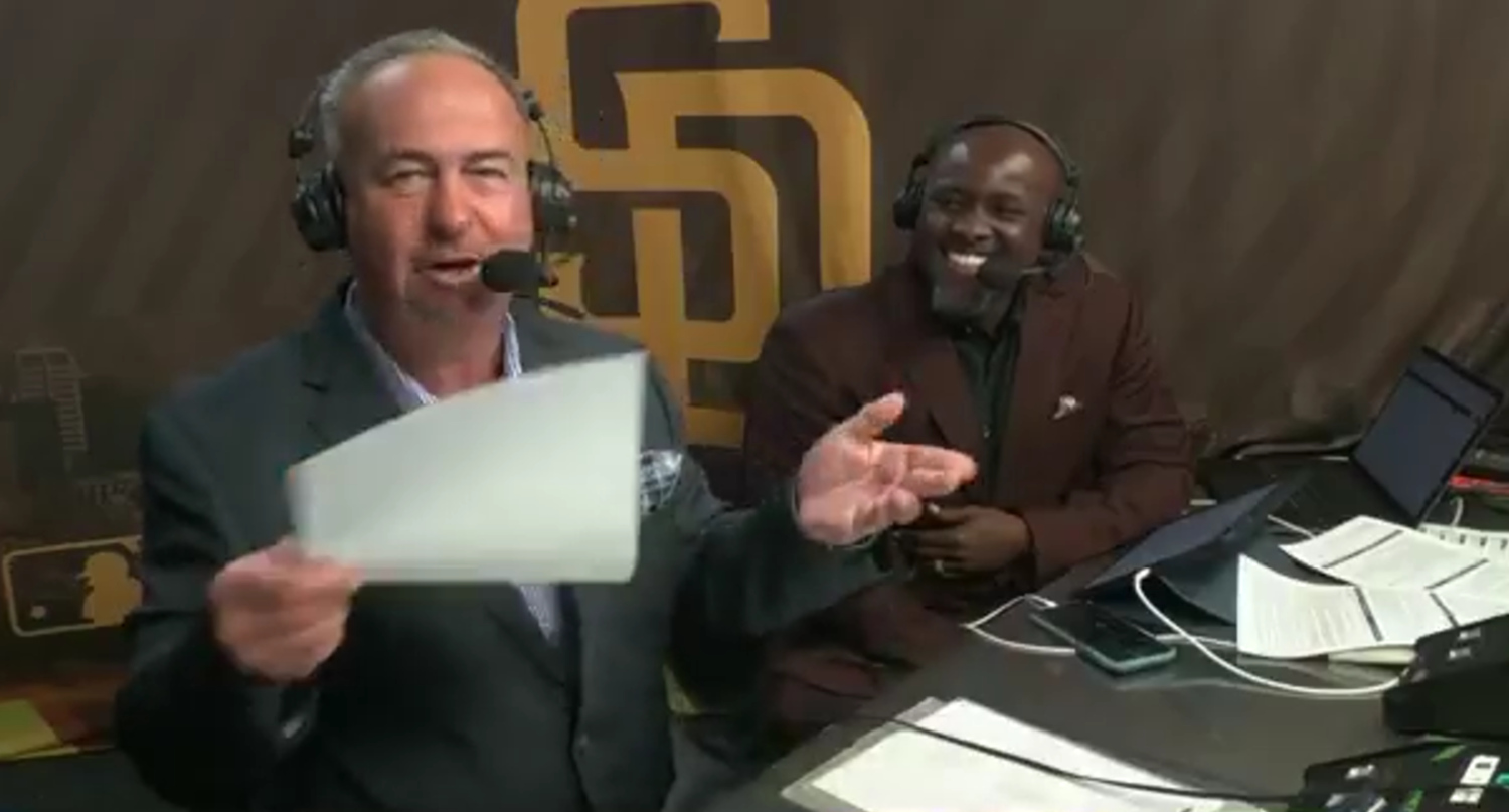 Don Orsillo demonstrating his paper-snap technique as Tony Gwynn Jr. looks on.