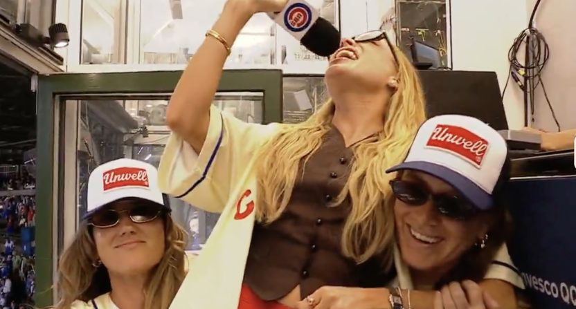'Call Her Daddy' podcaster Alex Cooper sings the seventh-inning stretch at Wrigley Field. Photo Credit: ESPN