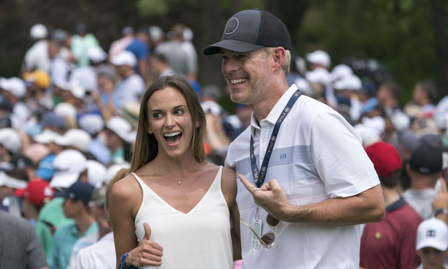 August 8, 2018; St. Louis, MO, USA; Jena Sims (left), girlfriend of Brooks Koepka (not pictured), poses with sportscaster Joe Buck (right) on the 10th green during the Wednesday practice round of the PGA Championship golf tournament at Bellerive Country Club.