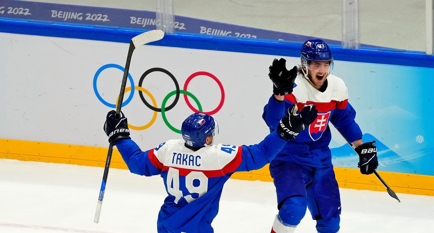 Team Slovakia forward Pavol Regenda (87) reacts after scoring a goal against Sweden during the third period with forward Samuel Takac (49) in the bronze medal menÕs ice hockey game during the Beijing 2022 Olympic Winter Games at National Indoor Stadium.