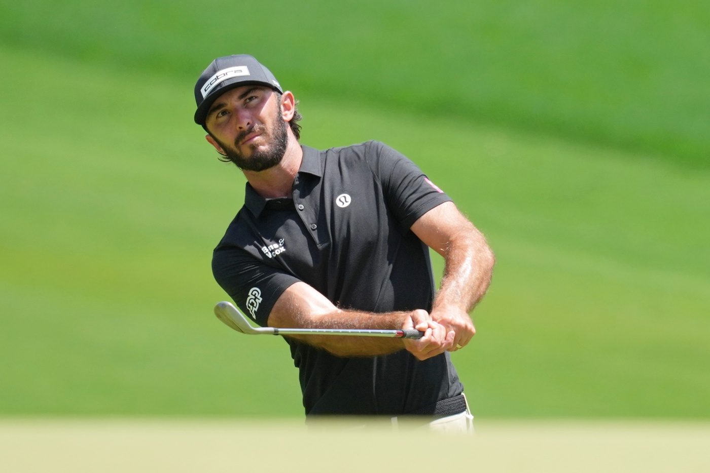 Max Homa takes a shot on the third hole during the third round of the PGA Championship golf tournament at Quail Hollow.