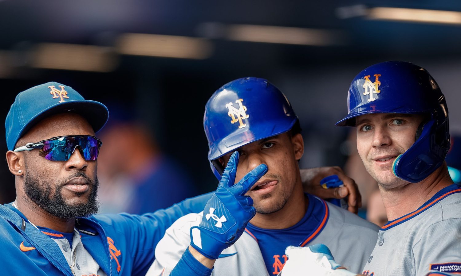 Jun 8, 2025; Denver, Colorado, USA; New York Mets outfielder Starling Marte (6) and right fielder Juan Soto (22) and first baseman Pete Alonso (20) celebrate in the dugout in the eighth inning against the Colorado Rockies at Coors Field.