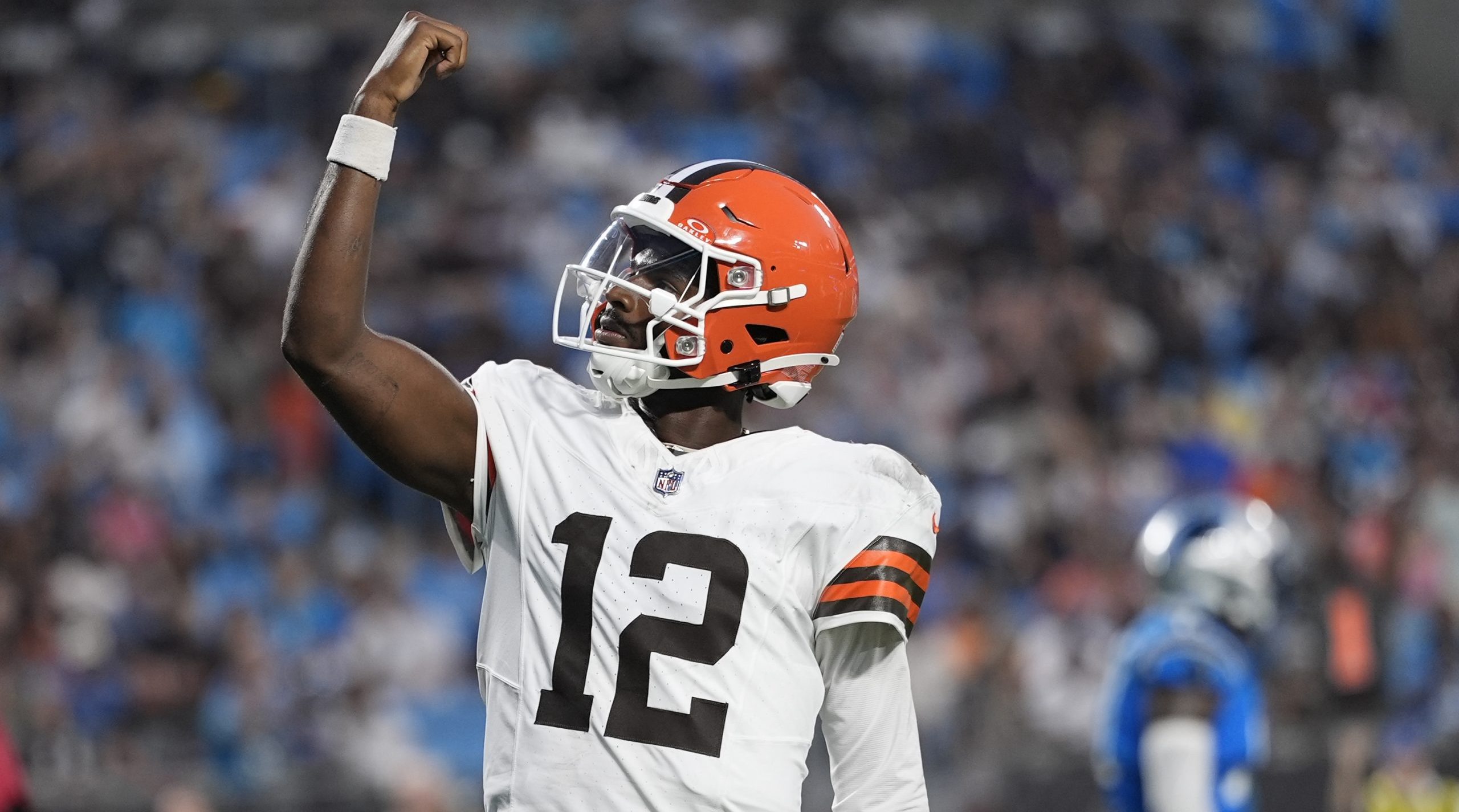 Shedeur Sanders celebrating after a touchdown pass in his preseason debut against the Panthers