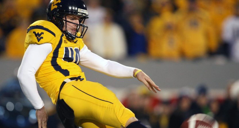 West Virginia Mountaineers kicker (40) Pat McAfee punts in the West Virginia Mountaineers 13-9 loss to the Pittsburgh Panthers at Mylan Puskar Stadium. Duhart recovered the fumble.