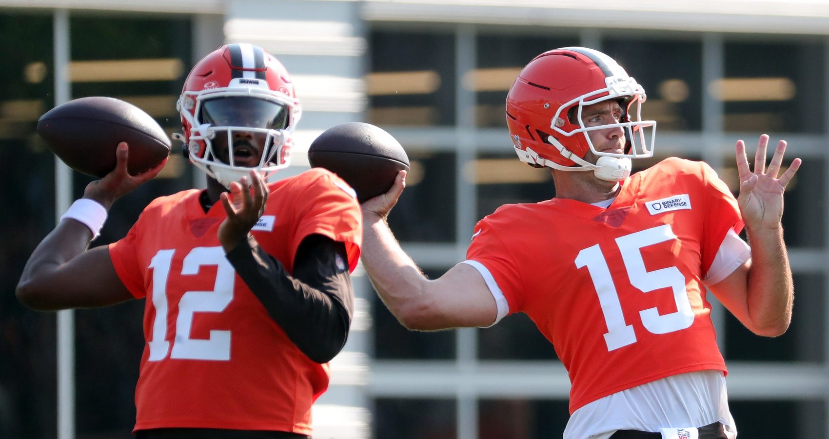 Cleveland Browns quarterback Joe Flacco (15) and quarterback Shedeur Sanders (12) look downfield during NFL training camp at CrossCountry Mortgage Campus, Wednesday, July 30, 2025, in Berea, Ohio.