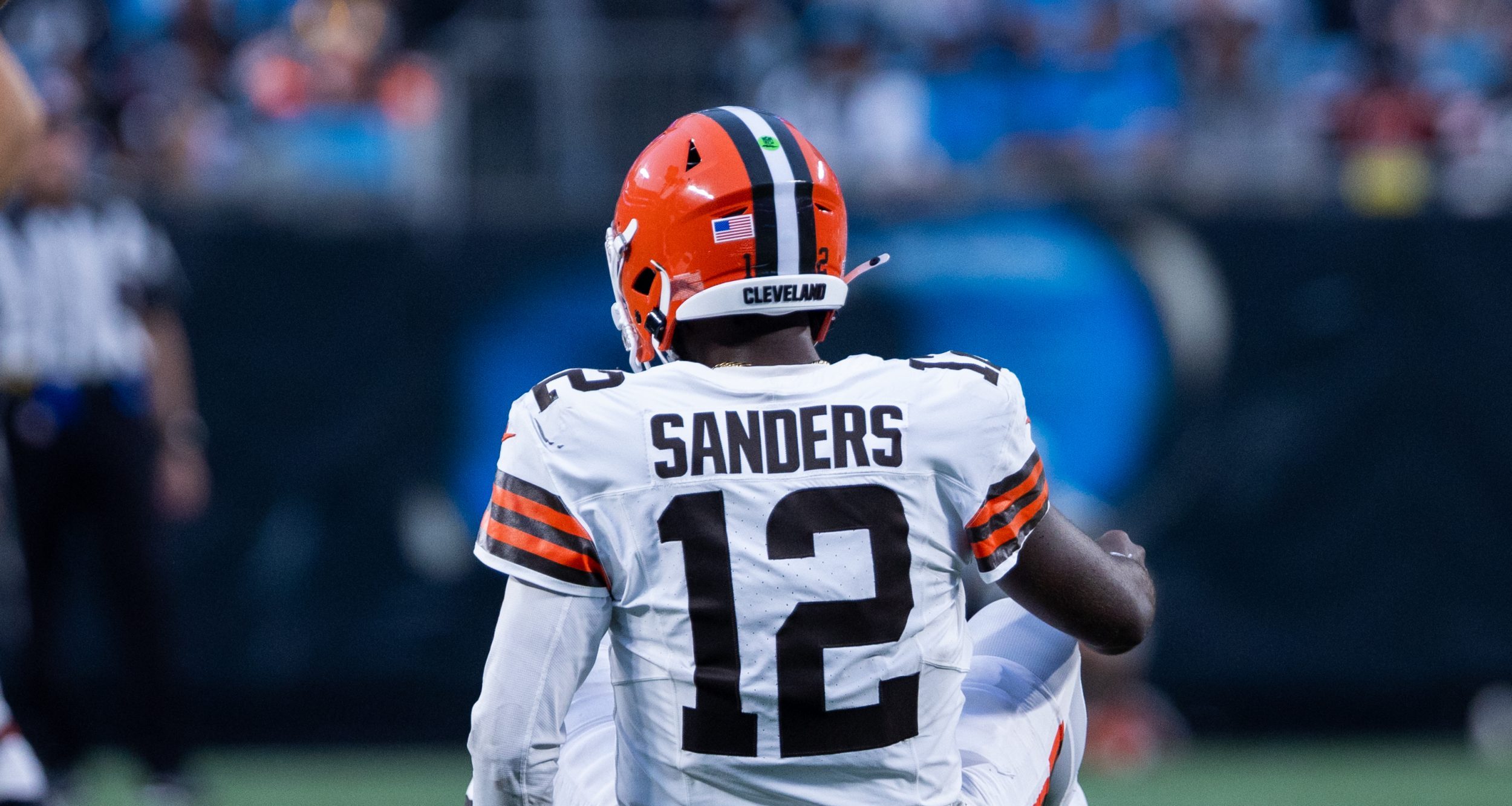 Aug 8, 2025; Charlotte, North Carolina, USA; Cleveland Browns quarterback Shedeur Sanders (12) gets up slow during the second quarter against the Carolina Panthers at Bank of America Stadium.
