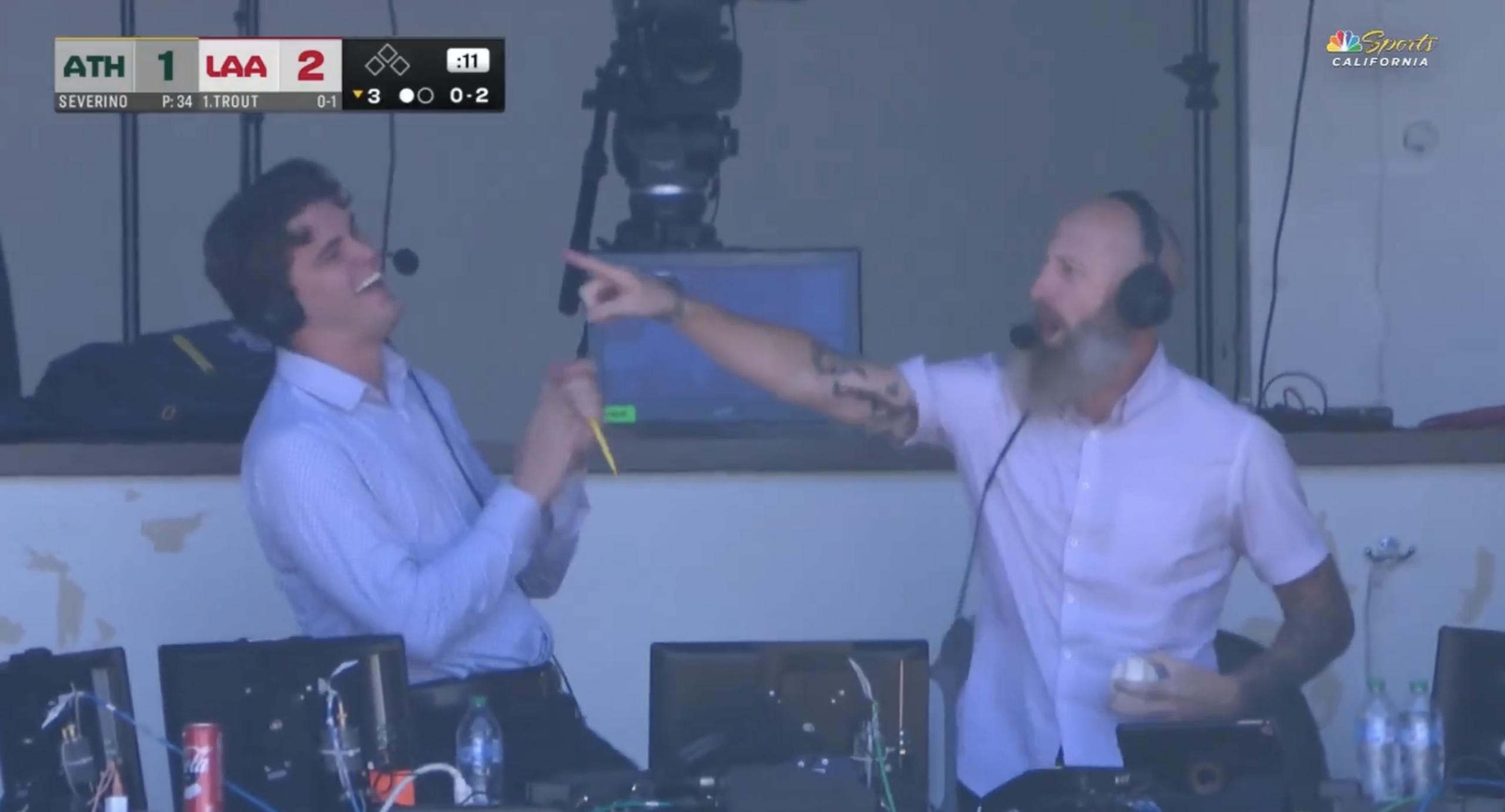 Dallas Braden celebrating after catching his first ever foul ball in the broadcast booth