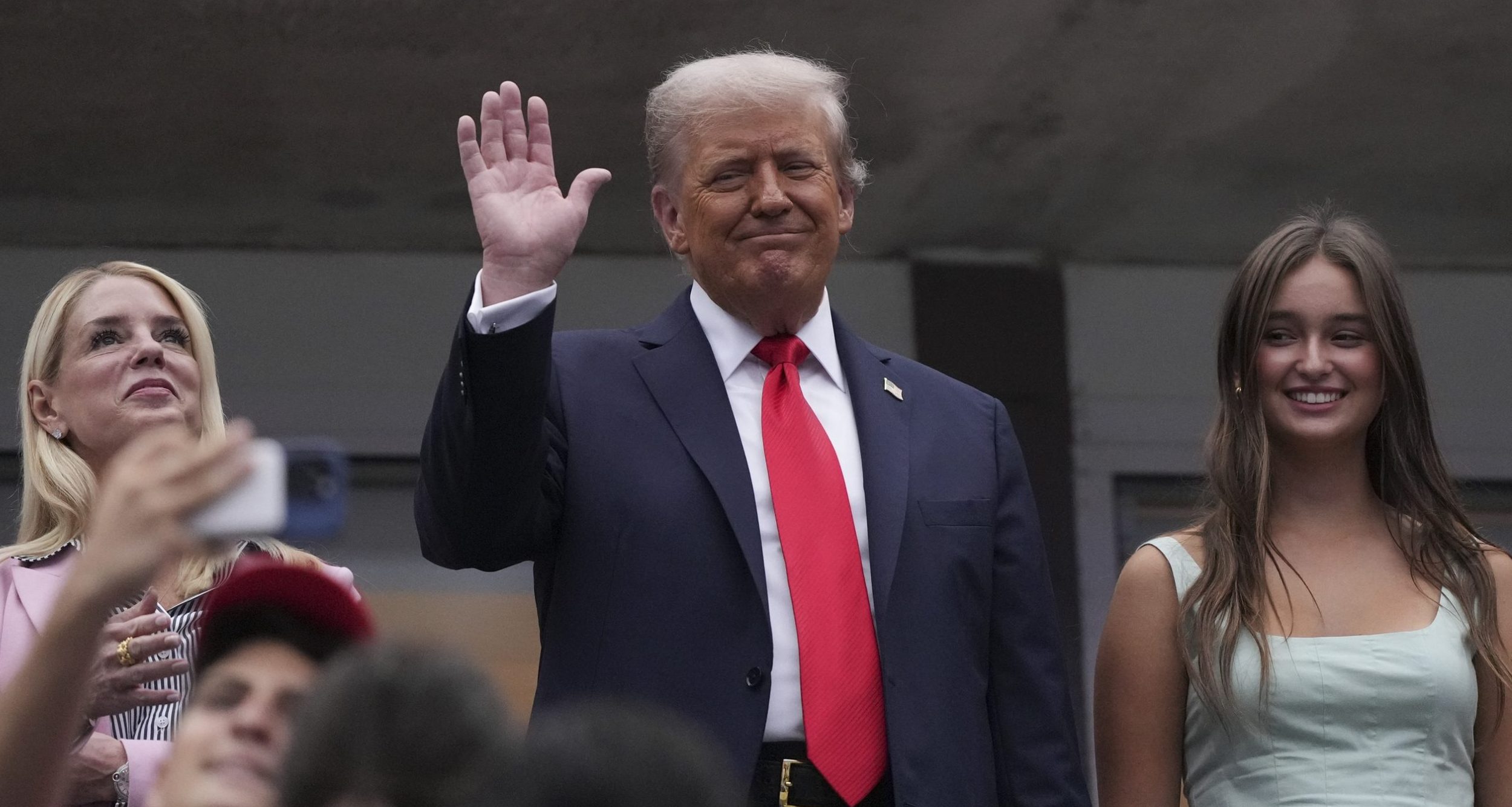 President Donald Trump waves