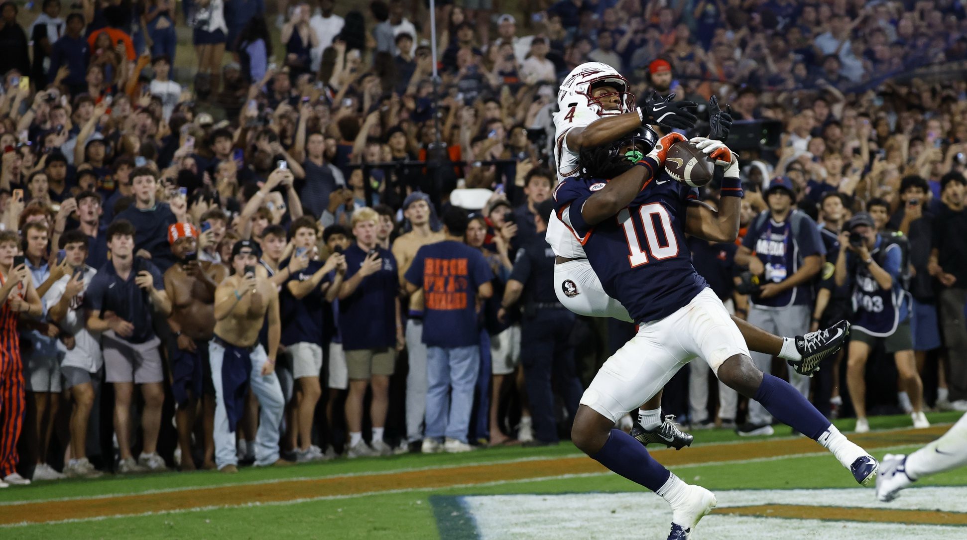 VVirginia Cavaliers defensive back Ja'son Prevard (10) makes a game winning interception in the end zone on a pass intended for Florida State Seminoles wide receiver Squirrel White (4) in the second overtime period at Scott Stadium.