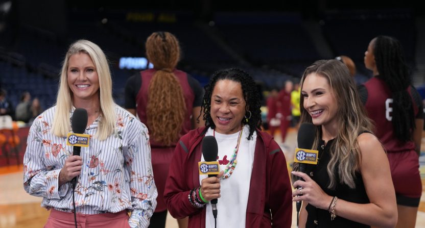 Apr 3, 2025; Tampa, FL, USA; South Carolina Gamecocks head coach Dawn Staley (center) is interviewed by SEC Network reporters Steffi Sorensen (left) and Alyssa Lang during practice at Amalie Arena.
