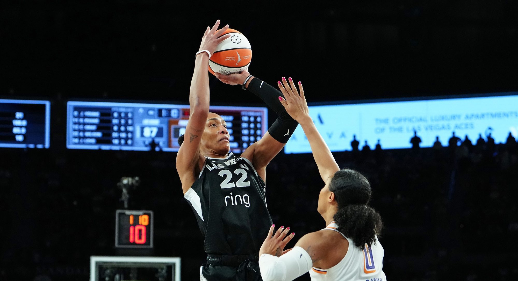 Oct 3, 2025; Las Vegas, Nevada, USA; Las Vegas Aces center A'ja Wilson (22) shoots against Phoenix Mercury forward Satou Sabally (0) during the fourth quarter of game one of the 2025 WNBA Finals at Michelob Ultra Arena.