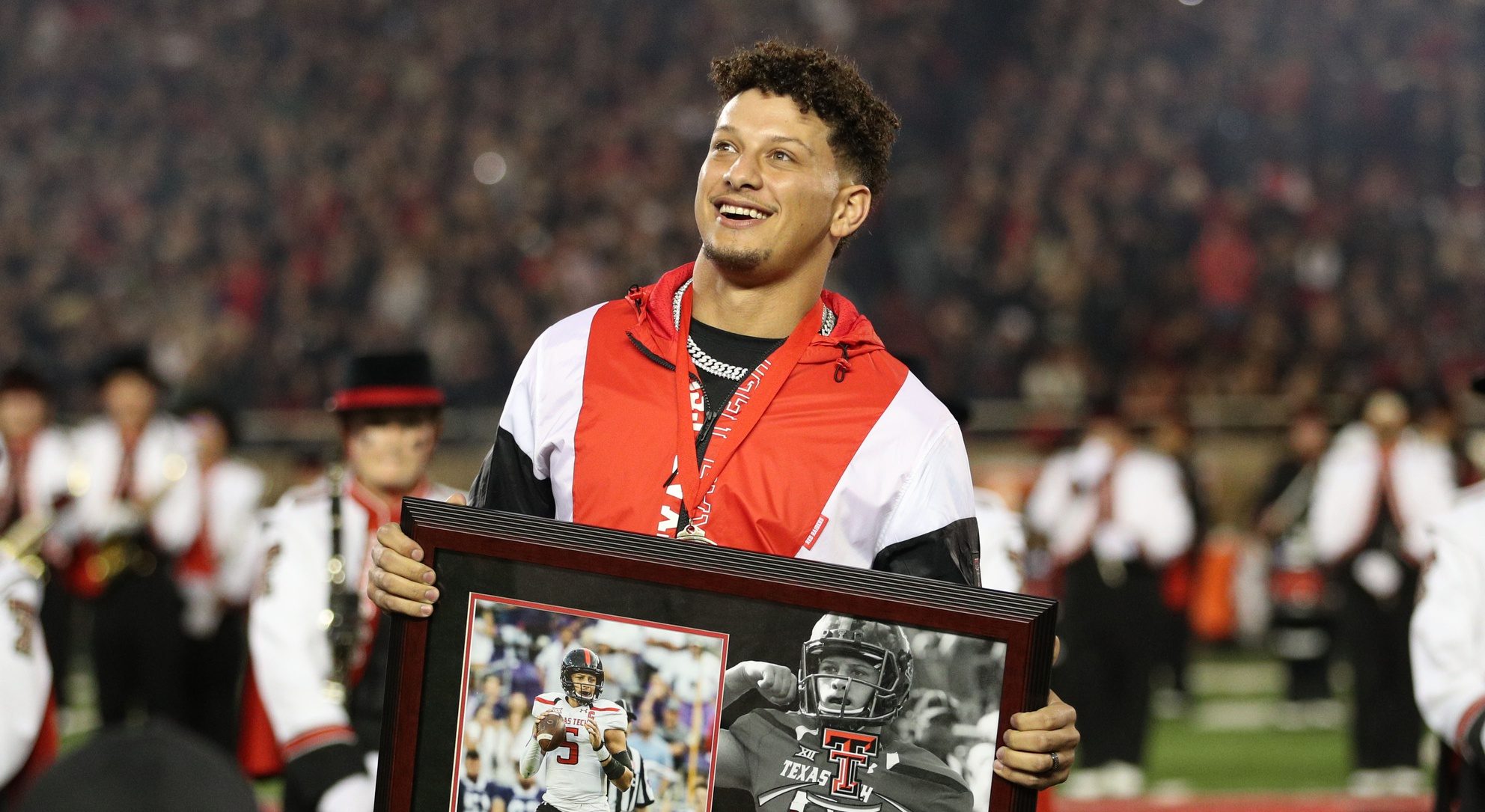 Kansas City Chiefs quarterback Patrick Mahomes II watches as his name is unveiled during his induction in the Ring of Honor at half-time of a game between the Texas Tech Red Raiders and the Baylor Bears at Jones AT&T Stadium and Cody Campbell Field.