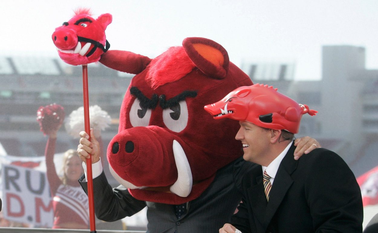 Lee Corso picks the Razorbacks to win the Arkansas/Tennessee game as Chris Fowler, left, and Kirk Herbstreit, right, end the show.