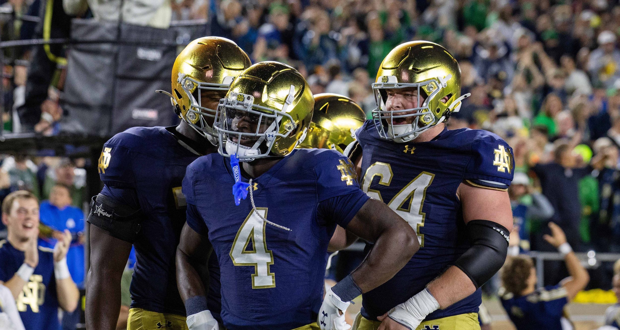 Oct 18, 2025; South Bend, Indiana, USA; Notre Dame Fighting Irish running back Jeremiyah Love (4) celebrates his touchdown with teammates in the first half against the Southern California Trojans at Notre Dame Stadium.