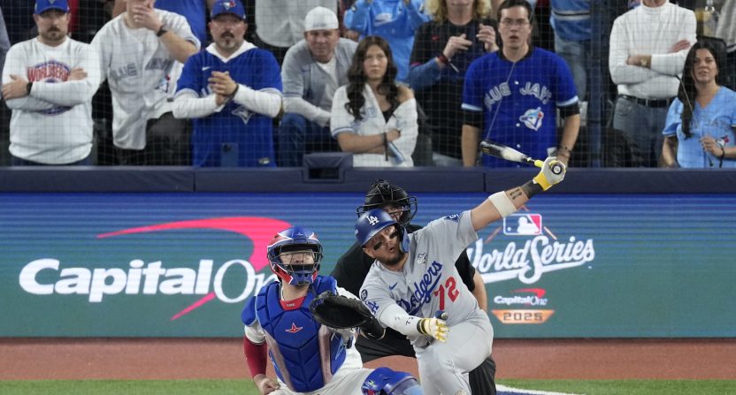 Nov 1, 2025; Toronto, Ontario, CAN; Los Angeles Dodgers second baseman Miguel Rojas (72) hits a home run against the Toronto Blue Jays in the ninth inning during game seven of the 2025 MLB World Series at Rogers Centre.