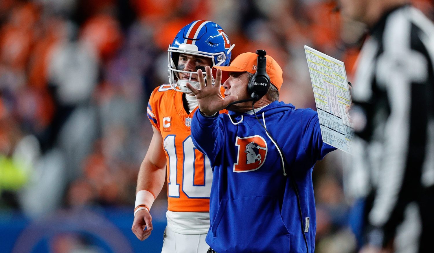 Nov 6, 2025; Denver, Colorado, USA; Denver Broncos quarterback Bo Nix (10) talks with head coach Sean Payton in the fourth quarter against the Las Vegas Raiders at Empower Field at Mile High.