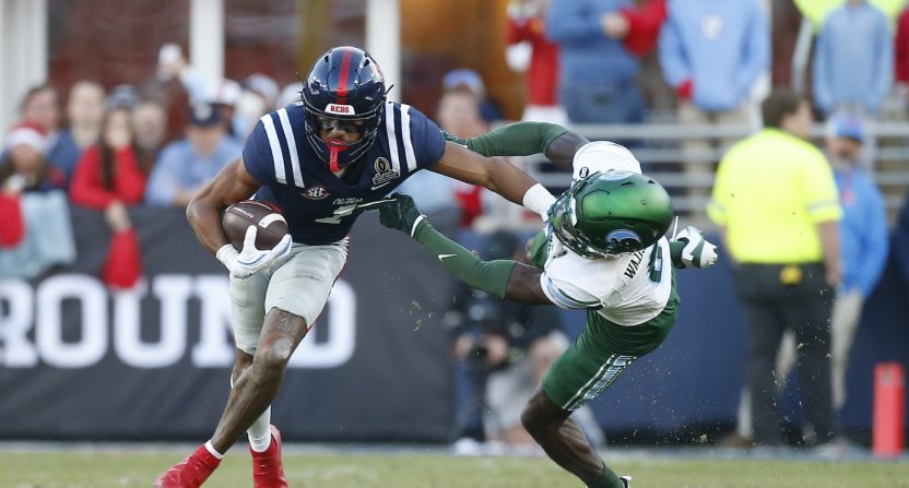 Mississippi Rebels wide receiver De'Zhaun Stribling (1) breaks the tackle attempt by Tulane Green Wave defensive back Isaiah Wadsworth (8) during the first half of a game at Vaught-Hemingway Stadium.